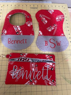 Baby bib and burp cloth sets with matching wristlet bag