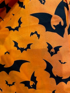 HALLOWEEN_Black bats on orange fabric scrub hat